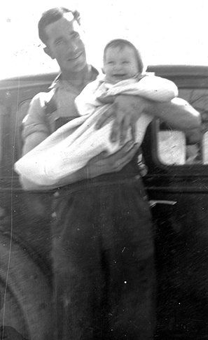 Father holding 1 year old Larry